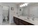 Bathroom features double sinks, dark cabinets, and bright lighting at 470 Wagon Hill Ln, Sugar Hill, GA 30518