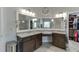 Bathroom with double sink, granite countertop, and view of walk-in closet at 470 Wagon Hill Ln, Sugar Hill, GA 30518