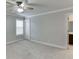 Bedroom offers neutral carpet, ceiling fan, and a window for ample natural light at 470 Wagon Hill Ln, Sugar Hill, GA 30518