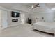 Open Primary bedroom featuring a tv, fire place, and bathroom entrance at 470 Wagon Hill Ln, Sugar Hill, GA 30518