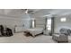Spacious bedroom with ample lighting, a ceiling fan, and neutral décor at 470 Wagon Hill Ln, Sugar Hill, GA 30518