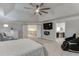 Open Primary bedroom featuring a fireplace, tv, staircase entrance, and bathroom entrance at 470 Wagon Hill Ln, Sugar Hill, GA 30518