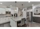 Modern kitchen with white cabinets, granite countertops, and stainless steel appliances at 470 Wagon Hill Ln, Sugar Hill, GA 30518