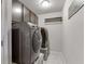 A functional laundry room featuring a modern washer and dryer, with storage and ample space at 470 Wagon Hill Ln, Sugar Hill, GA 30518