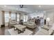 Spacious living room with hardwood floors, large windows, and open layout at 470 Wagon Hill Ln, Sugar Hill, GA 30518