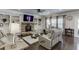Bright living room with fireplace, plush seating and backyard view at 470 Wagon Hill Ln, Sugar Hill, GA 30518