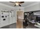 Spacious office boasts hardwood flooring, built-in storage, and natural light, ideal for productivity at 470 Wagon Hill Ln, Sugar Hill, GA 30518