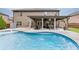 An inviting backyard pool with patio and outdoor seating, perfect for entertaining and relaxing at 470 Wagon Hill Ln, Sugar Hill, GA 30518