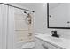 Bathroom featuring a shower-tub combination, toilet, sink, and black fixtures at 3775 Reston Ln, Decatur, GA 30034