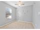 Cozy bedroom with a ceiling fan, natural light, and neutral colors, creating a serene and comfortable space at 3775 Reston Ln, Decatur, GA 30034