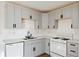Updated kitchen with gray cabinets, sleek countertops, and modern appliances offering a clean and functional space at 3775 Reston Ln, Decatur, GA 30034