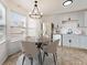 Bright eat-in kitchen features stainless steel appliances, modern cabinets, a chandelier, and lots of natural light at 3775 Reston Ln, Decatur, GA 30034