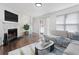 Bright living room features a fireplace, hardwood floors, and sliding glass doors to a balcony at 3775 Reston Ln, Decatur, GA 30034