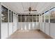 Enclosed sunroom providing an adaptable area for leisure or storage, with views of the outdoors at 3775 Reston Ln, Decatur, GA 30034