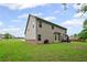Spacious backyard with green grass, patio area and grill at 397 Victory Ln Ln, Locust Grove, GA 30248