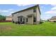 Backyard featuring a patio area, grill, green grass and blue skies at 397 Victory Ln Ln, Locust Grove, GA 30248