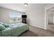 Bright bedroom with a window view and a spacious layout for comfortable living at 397 Victory Ln Ln, Locust Grove, GA 30248