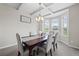 Elegant dining room featuring stylish chairs, a dark wooden table, and natural light at 397 Victory Ln Ln, Locust Grove, GA 30248