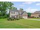 Lovely two-story home with a two-car garage and a beautifully landscaped front yard at 397 Victory Ln Ln, Locust Grove, GA 30248