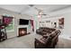Comfortable living room with a fireplace, TV, and large sectional sofa for relaxation at 397 Victory Ln Ln, Locust Grove, GA 30248