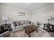 Cozy living room with comfortable seating, lamps, and decorative coffee table at 397 Victory Ln Ln, Locust Grove, GA 30248
