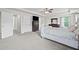 Bright main bedroom featuring neutral tones, carpet flooring, and natural light at 397 Victory Ln Ln, Locust Grove, GA 30248