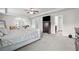 A spacious main bedroom with sitting area, neutral color palette, carpet and ceiling fan at 397 Victory Ln Ln, Locust Grove, GA 30248