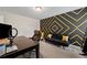 Stylish office with unique geometric wall design and comfortable work space at 397 Victory Ln Ln, Locust Grove, GA 30248