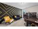 Stylish office with unique geometric wall design and comfortable work space at 397 Victory Ln Ln, Locust Grove, GA 30248