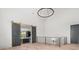 Bonus room featuring hardwood floors, modern railing, and large sliding barn doors at 4927 Slaton Dr, Acworth, GA 30101