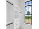 Bright closet featuring custom shelving and drawers, complemented by a scenic outdoor view at 4927 Slaton Dr, Acworth, GA 30101
