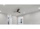 Bright, empty room with white shiplap and a modern ceiling fan at 4927 Slaton Dr, Acworth, GA 30101