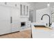 Modern kitchen features white cabinetry, built-in microwave, and stone countertops at 4927 Slaton Dr, Acworth, GA 30101