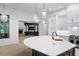 Bright kitchen showcases a large island with stone counters and pendant lighting at 4927 Slaton Dr, Acworth, GA 30101
