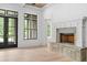 Bright living room with fireplace and black frame windows at 4927 Slaton Dr, Acworth, GA 30101