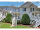 Rear exterior featuring a private back porch, well-maintained lawn and mature landscaping at 620 Neel Reid Dr, Roswell, GA 30075