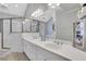 Bathroom featuring double vanity, a large mirror, and shower at 620 Neel Reid Dr, Roswell, GA 30075