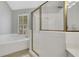 Clean bathroom showcasing a separate shower and tub with white tile at 620 Neel Reid Dr, Roswell, GA 30075