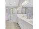 Well-lit bathroom featuring double vanity, shower and bathtub at 620 Neel Reid Dr, Roswell, GA 30075