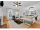Open-concept dining area featuring hardwood floors and stylish light fixtures at 620 Neel Reid Dr, Roswell, GA 30075