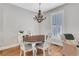 Bright dining room featuring a wooden table, hardwood floors and natural light at 620 Neel Reid Dr, Roswell, GA 30075