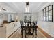 Elegant dining room with hardwood floors, stylish seating, and natural light at 620 Neel Reid Dr, Roswell, GA 30075