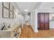 Elegant entryway with hardwood floors, decorative console table, and classic architectural details at 620 Neel Reid Dr, Roswell, GA 30075