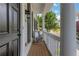 Inviting front porch featuring chair seating and an attractive black front door at 620 Neel Reid Dr, Roswell, GA 30075