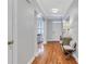Inviting hallway with hardwood floors, archway, neutral colors, and decorative furniture at 620 Neel Reid Dr, Roswell, GA 30075