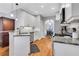 Modern kitchen with granite countertops, stainless steel appliances, and hardwood floors at 620 Neel Reid Dr, Roswell, GA 30075