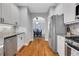 Beautiful kitchen with white cabinets, stainless appliances, and hardwood floors at 620 Neel Reid Dr, Roswell, GA 30075