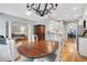 Open concept kitchen and dining room with hardwood floors and bright light at 620 Neel Reid Dr, Roswell, GA 30075