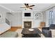 Inviting living room features a fireplace with built-in shelving and large windows at 620 Neel Reid Dr, Roswell, GA 30075