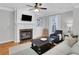 Comfortable living room with fireplace, built-in shelving, and ample natural light at 620 Neel Reid Dr, Roswell, GA 30075
